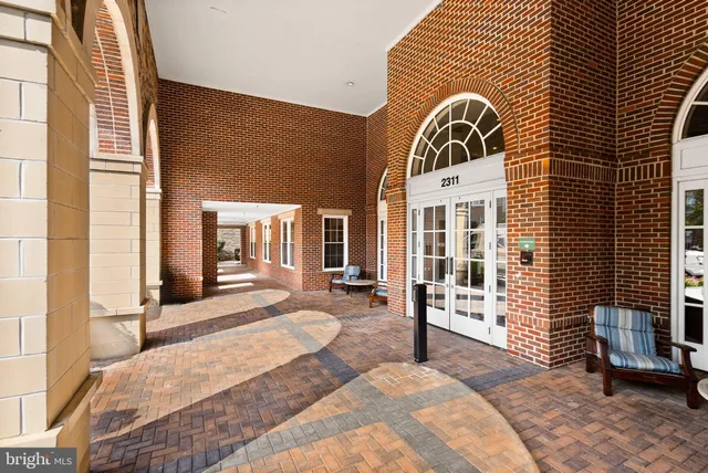 a view of a brick building with many windows