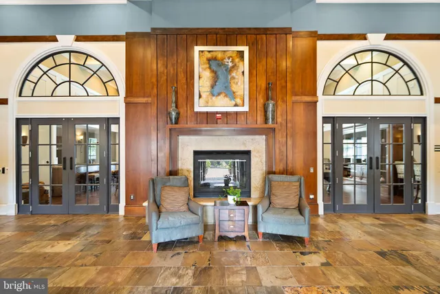 a view of hall way with furniture and window