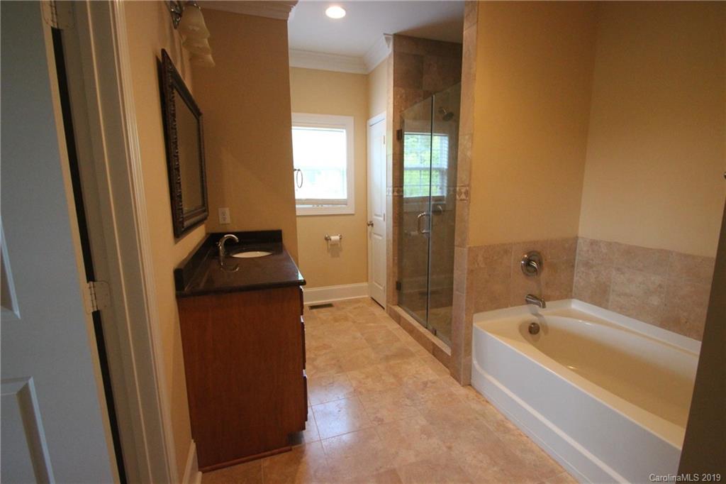 526 Maynard Grayson Road Clover, SC 29710 - Photo 17 of 19 a spacious bathroom with a tub sink and mirror