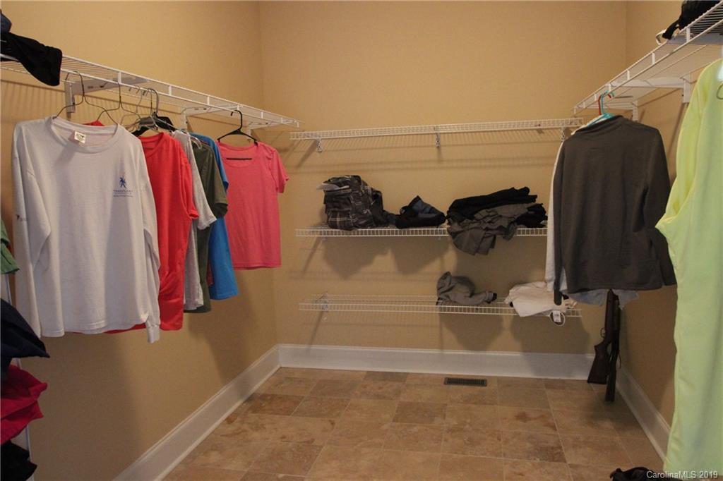 526 Maynard Grayson Road Clover, SC 29710 - Photo 18 of 19 a view of walk in closet with clothes and shoes