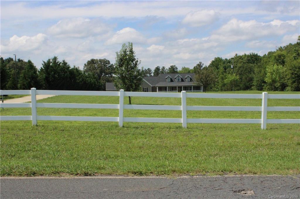 526 Maynard Grayson Road Clover, SC 29710 - Photo 6 of 19 a view of a green field with wooden fence