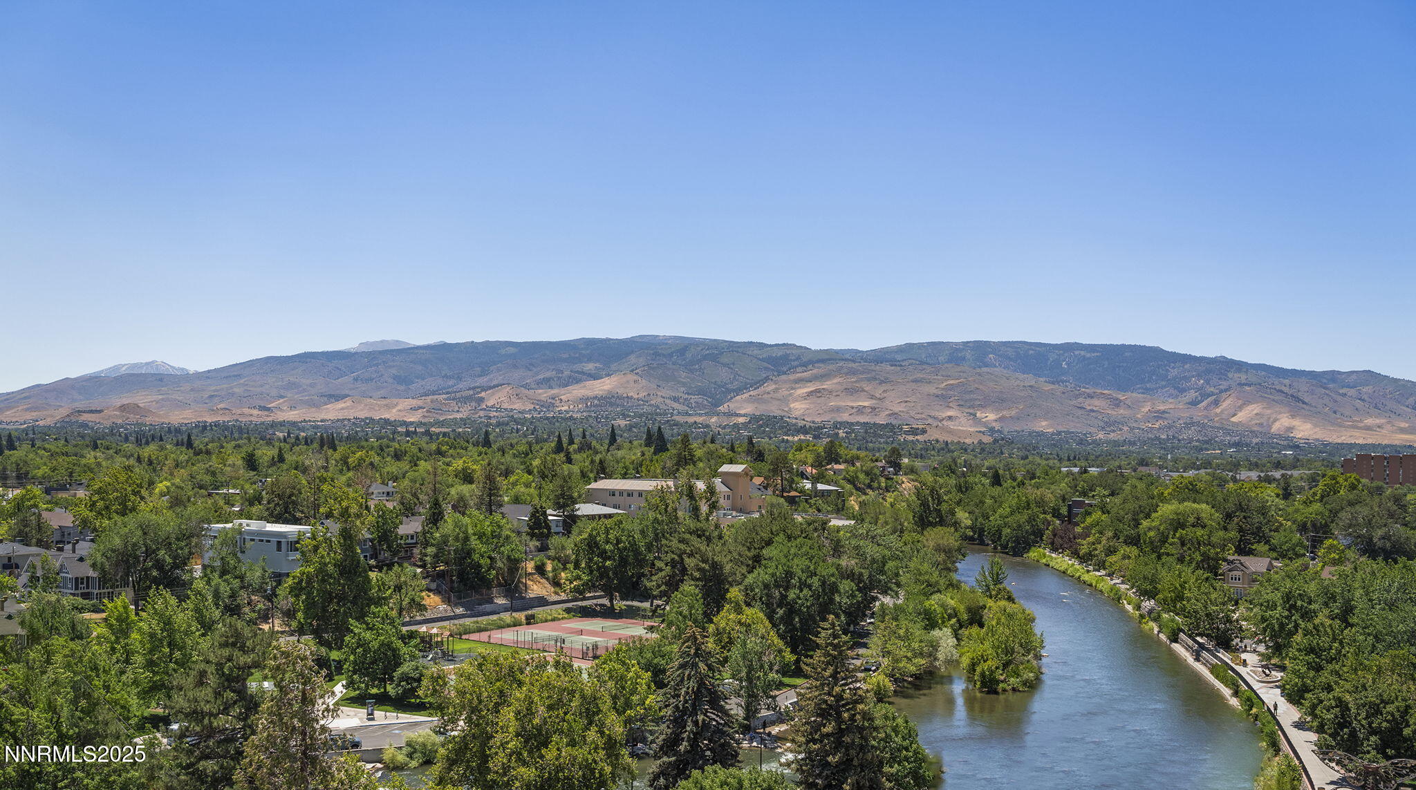 100 North Arlington Avenue, Unit 10E Reno, NV 89501 - Photo 30 of 47 a view of a lush green hillside and houses