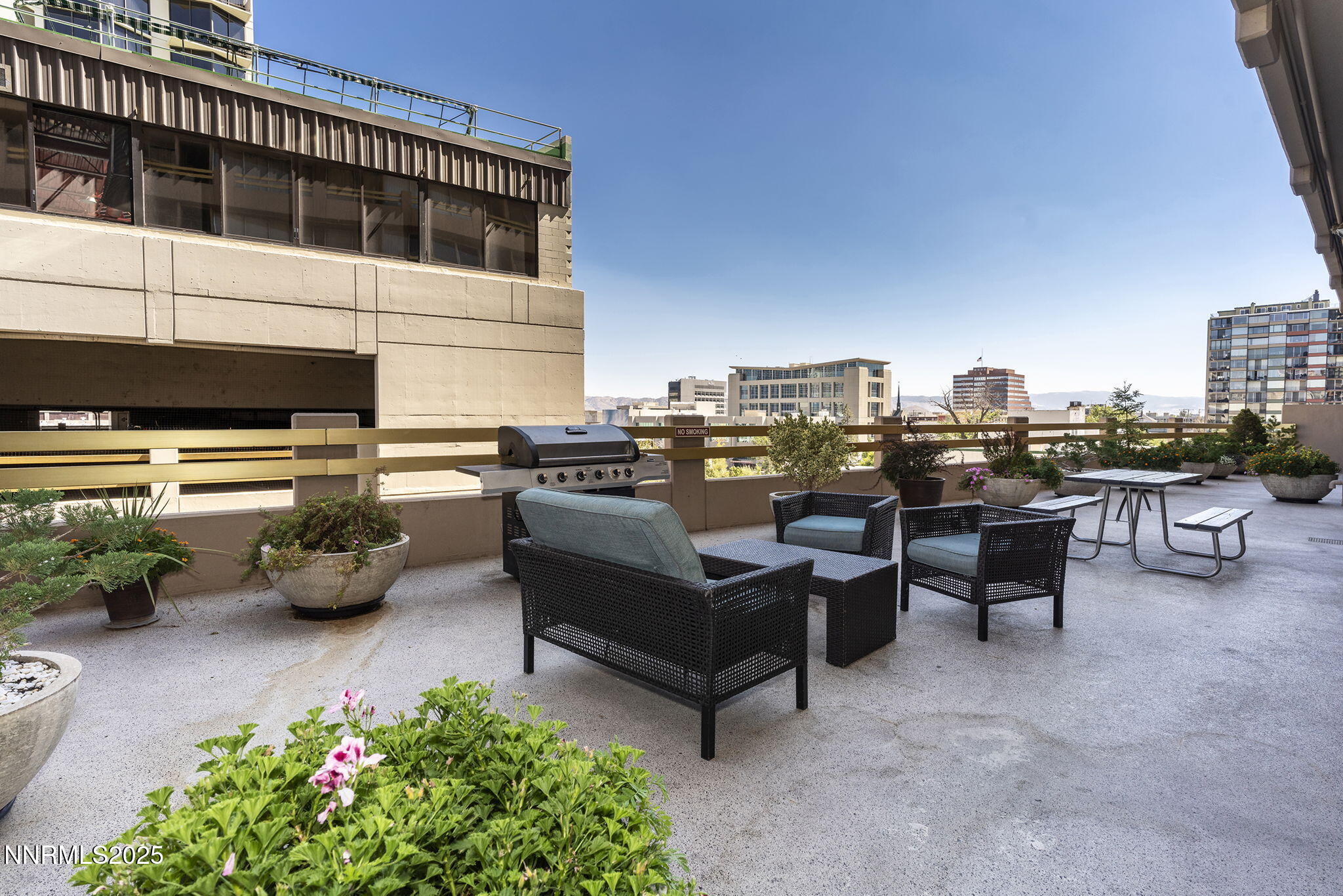 100 North Arlington Avenue, Unit 10E Reno, NV 89501 - Photo 45 of 47 a roof deck with couches and potted plants