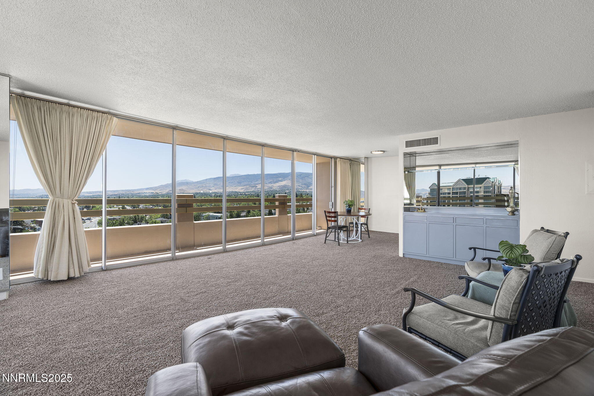 100 North Arlington Avenue, Unit 10E Reno, NV 89501 - Photo 5 of 47 a living room with furniture and a large window