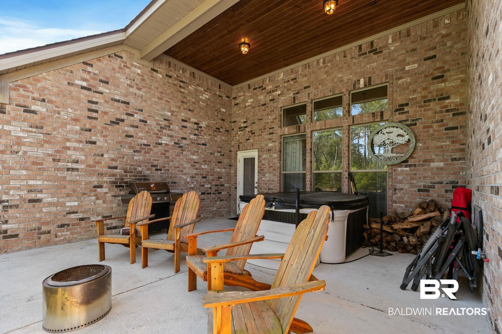 31911 Bobwhite Road Daphne, AL 36527 - Photo 48 of 85 View of patio with a hot tub and a grill