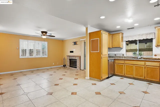 a kitchen with a stove a sink and a microwave