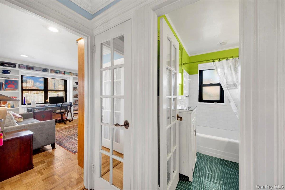 266 Pelham Road, Unit 5H New Rochelle, NY 10805 - Photo 15 of 27 a view of a hallway with bathroom and glass door