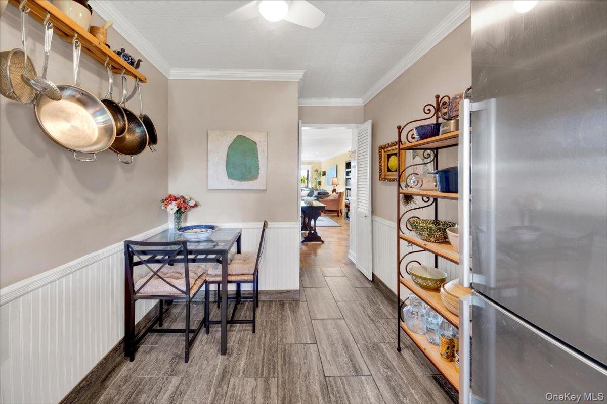 266 Pelham Road, Unit 5H New Rochelle, NY 10805 - Photo 6 of 27 a view of a dining room with furniture and wooden floor