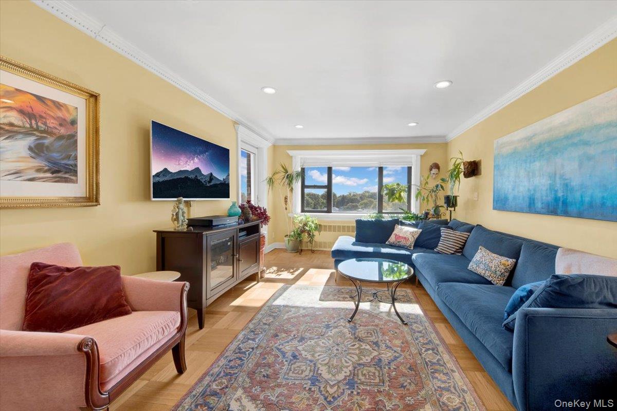 266 Pelham Road, Unit 5H New Rochelle, NY 10805 - Photo 10 of 27 a living room with furniture and a flat screen tv