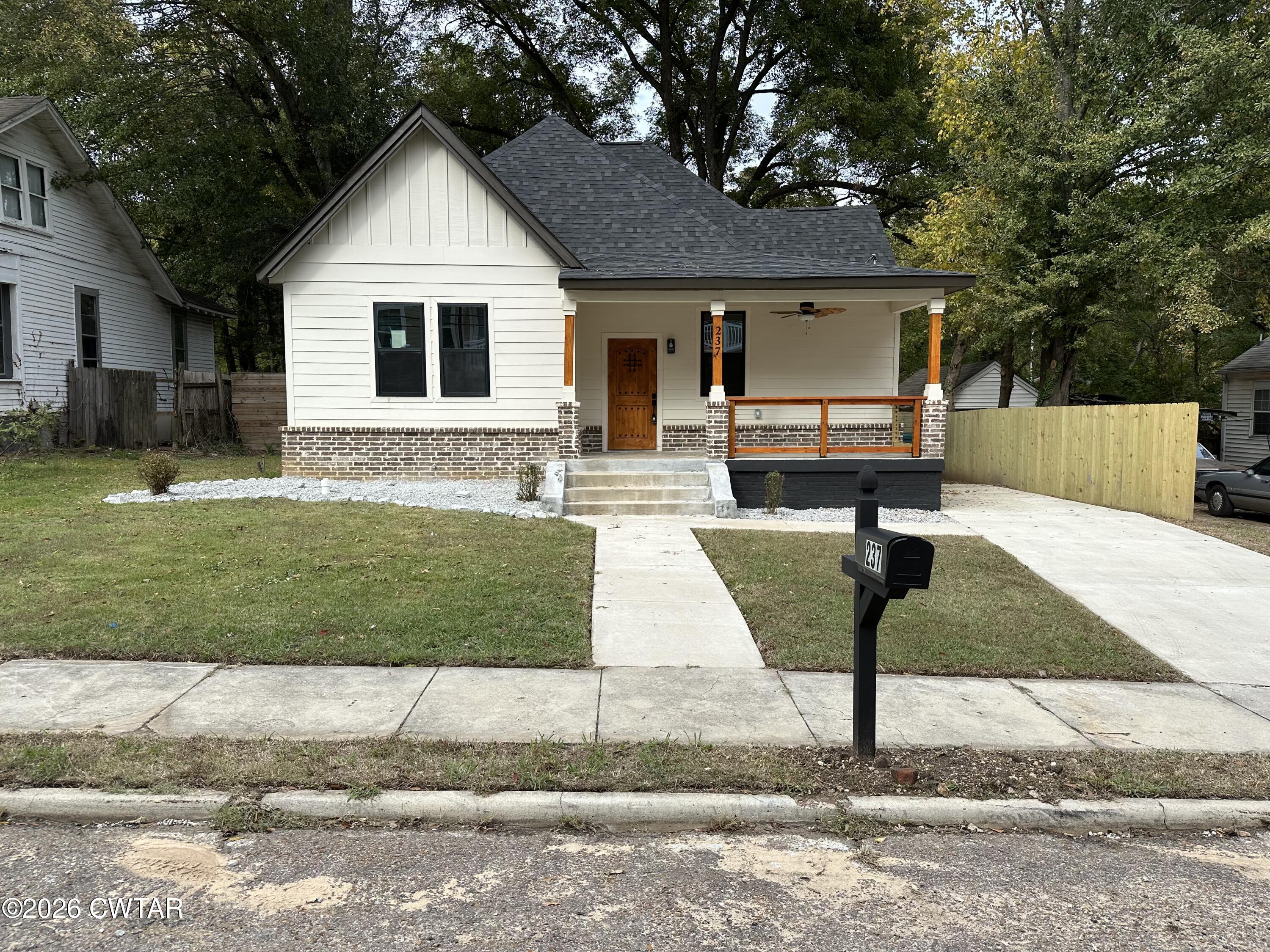 237 Talbot Street Jackson, TN 38301 - Photo 1 of 38 a front view of a house with a yard
