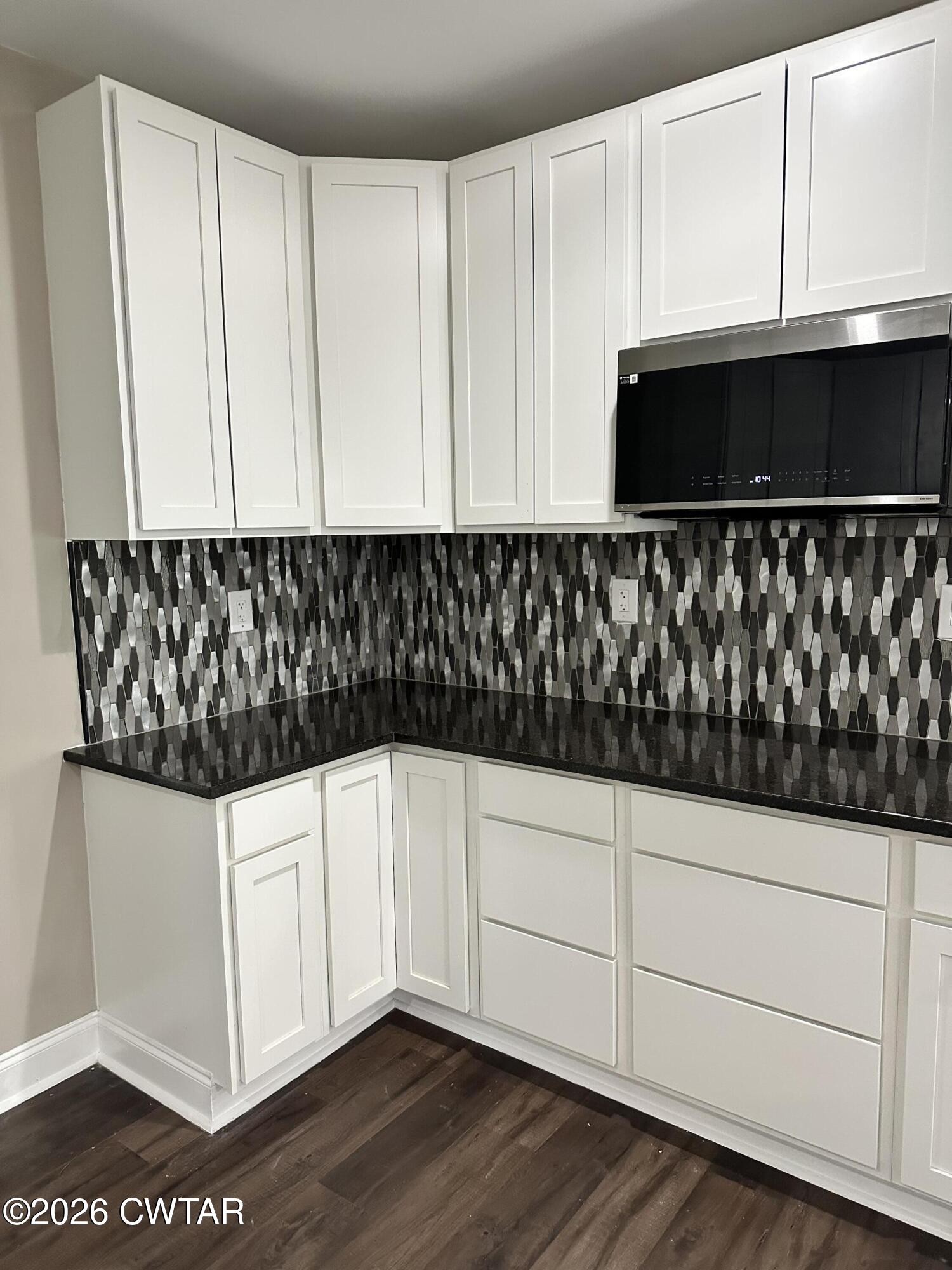 237 Talbot Street Jackson, TN 38301 - Photo 16 of 38 a kitchen with white cabinets