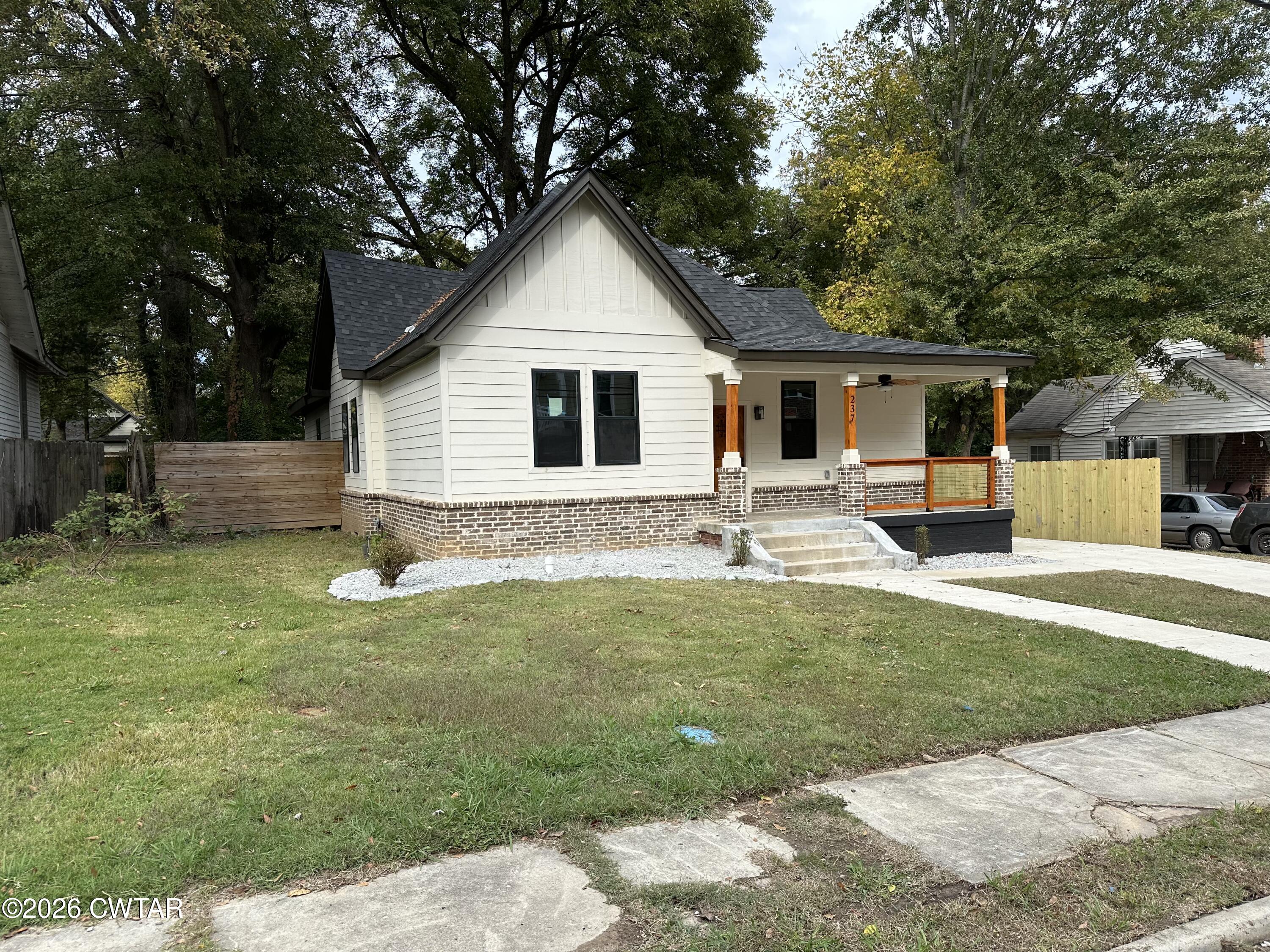 237 Talbot Street Jackson, TN 38301 - Photo 2 of 38 a front view of house with yard and tree in it