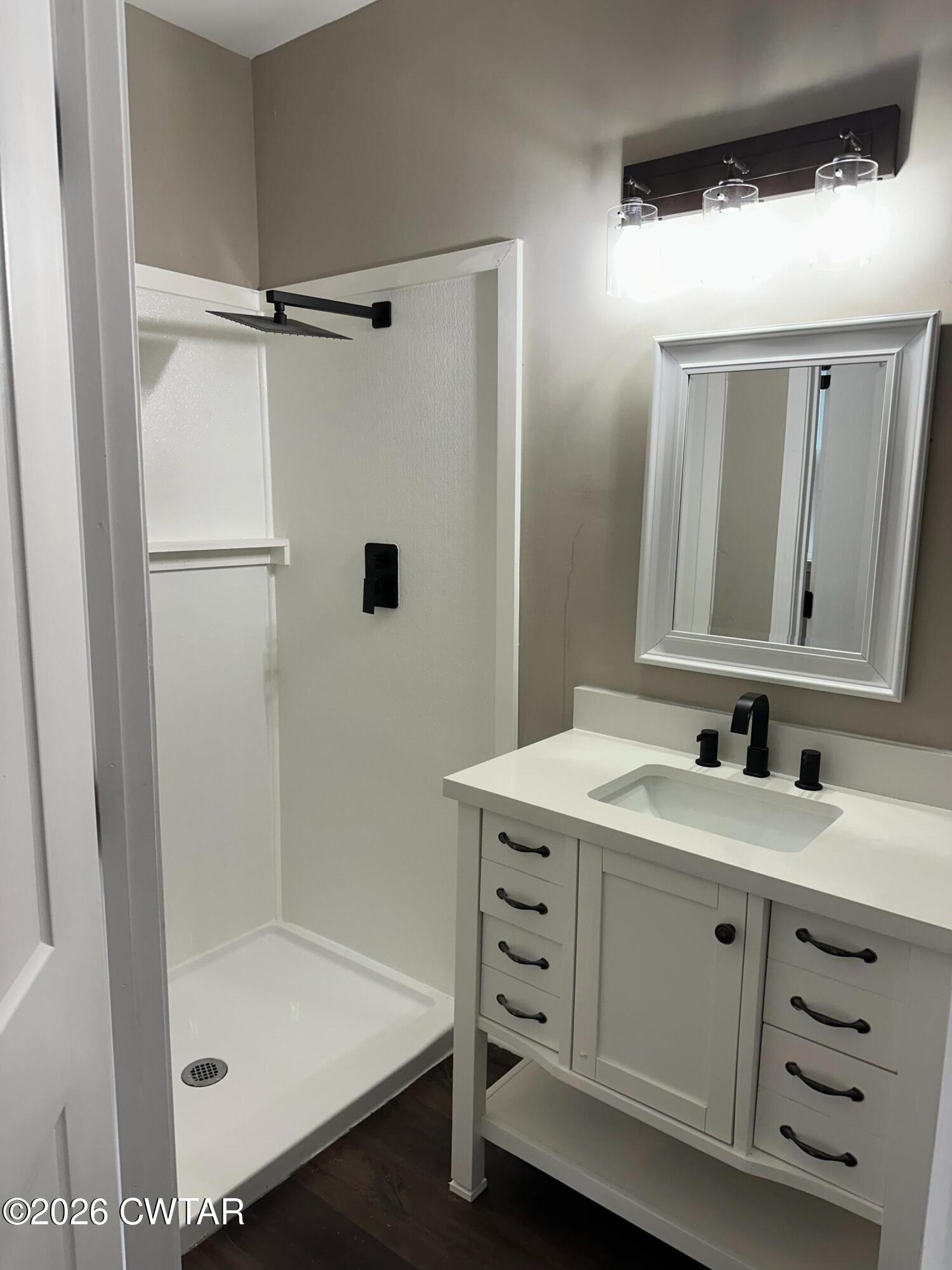 237 Talbot Street Jackson, TN 38301 - Photo 21 of 38 a bathroom with a double vanity sink mirror and shower