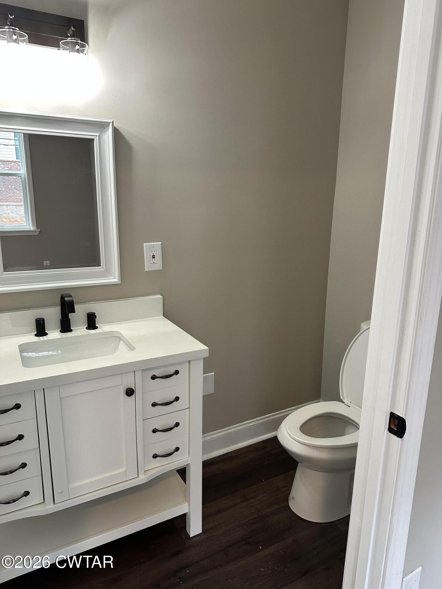 237 Talbot Street Jackson, TN 38301 - Photo 24 of 38 a bathroom with a toilet sink and mirror