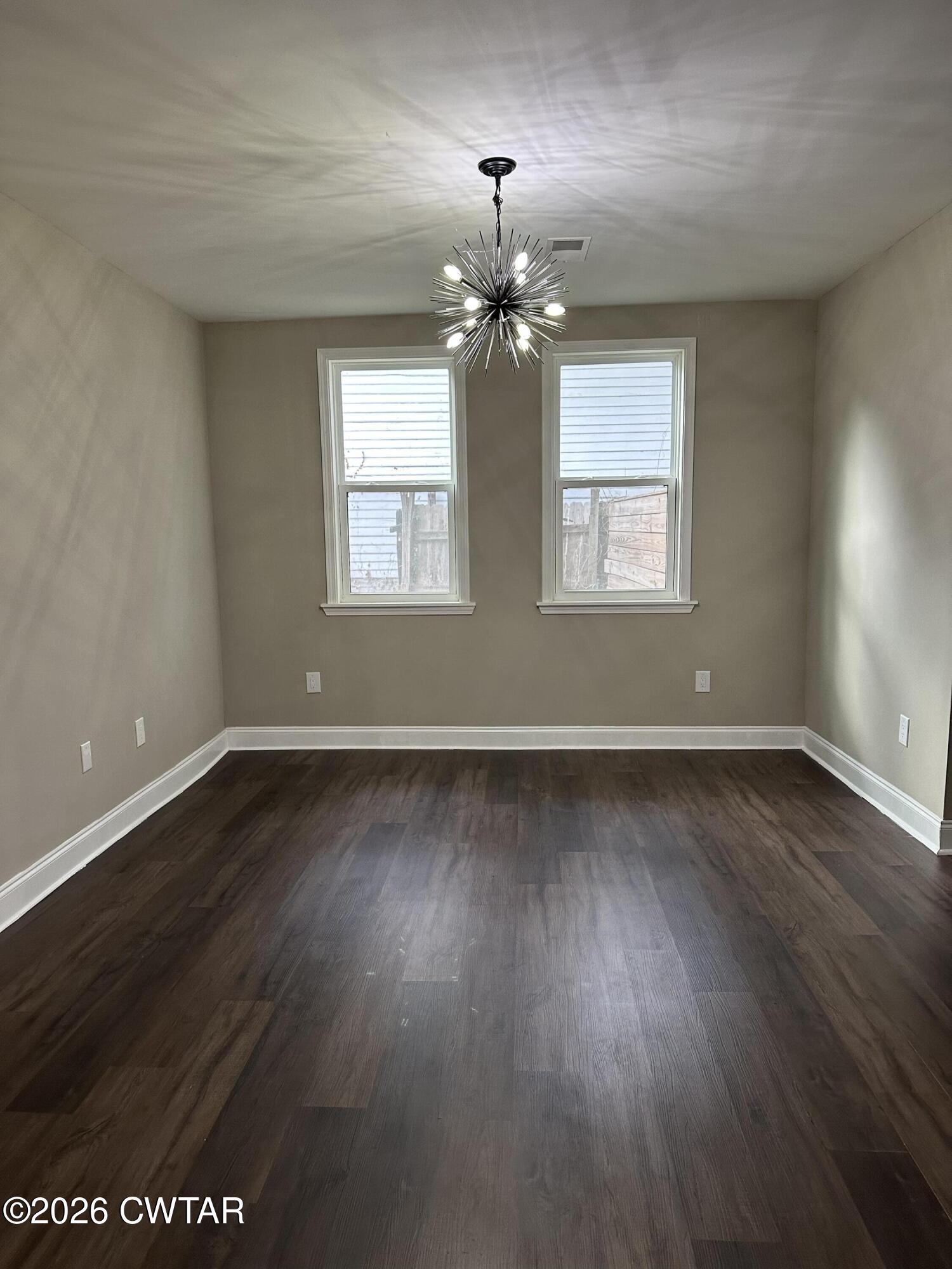 237 Talbot Street Jackson, TN 38301 - Photo 25 of 38 wooden floor in an empty room with a window