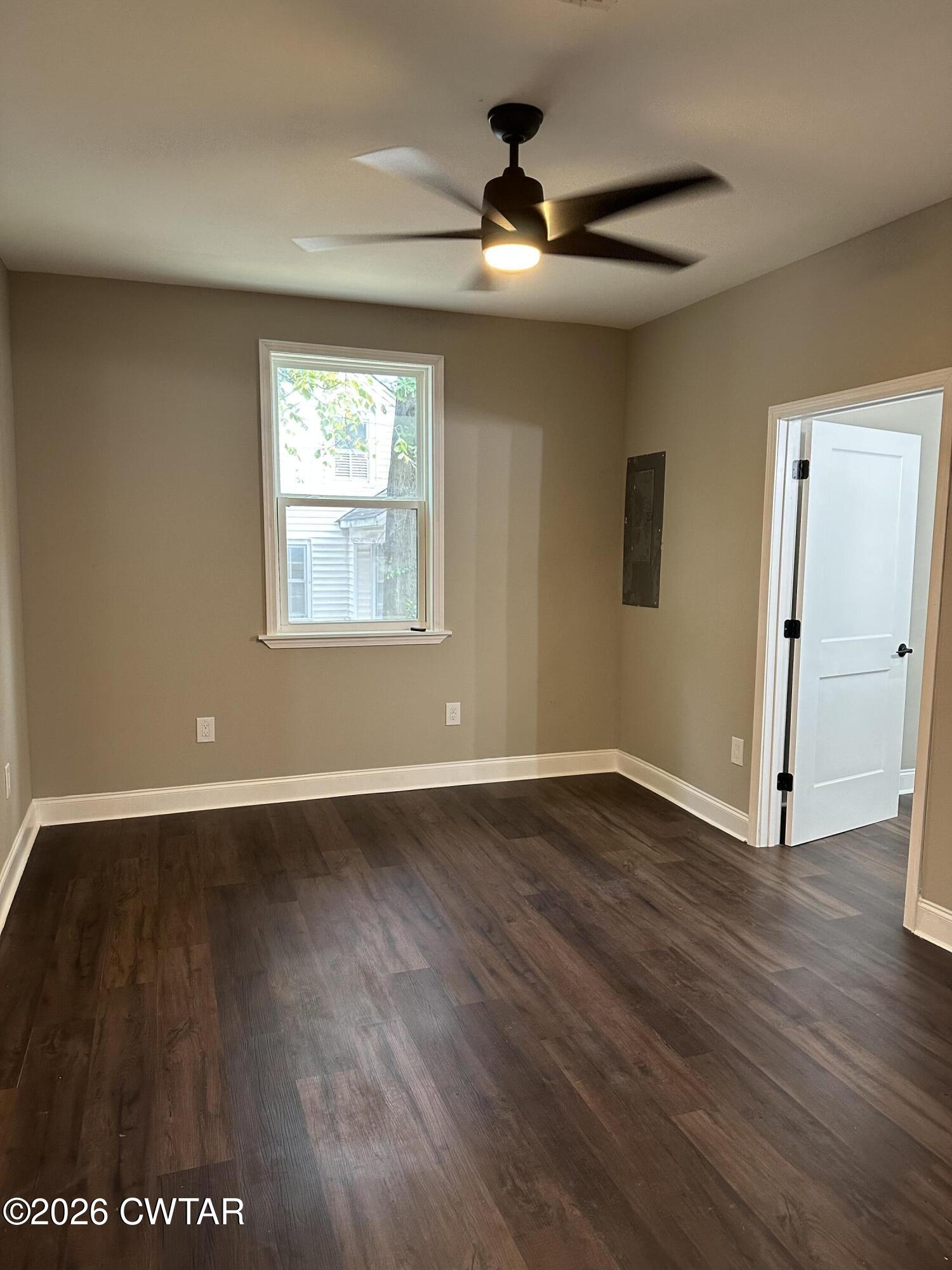 237 Talbot Street Jackson, TN 38301 - Photo 28 of 38 an empty room with wooden floor and windows