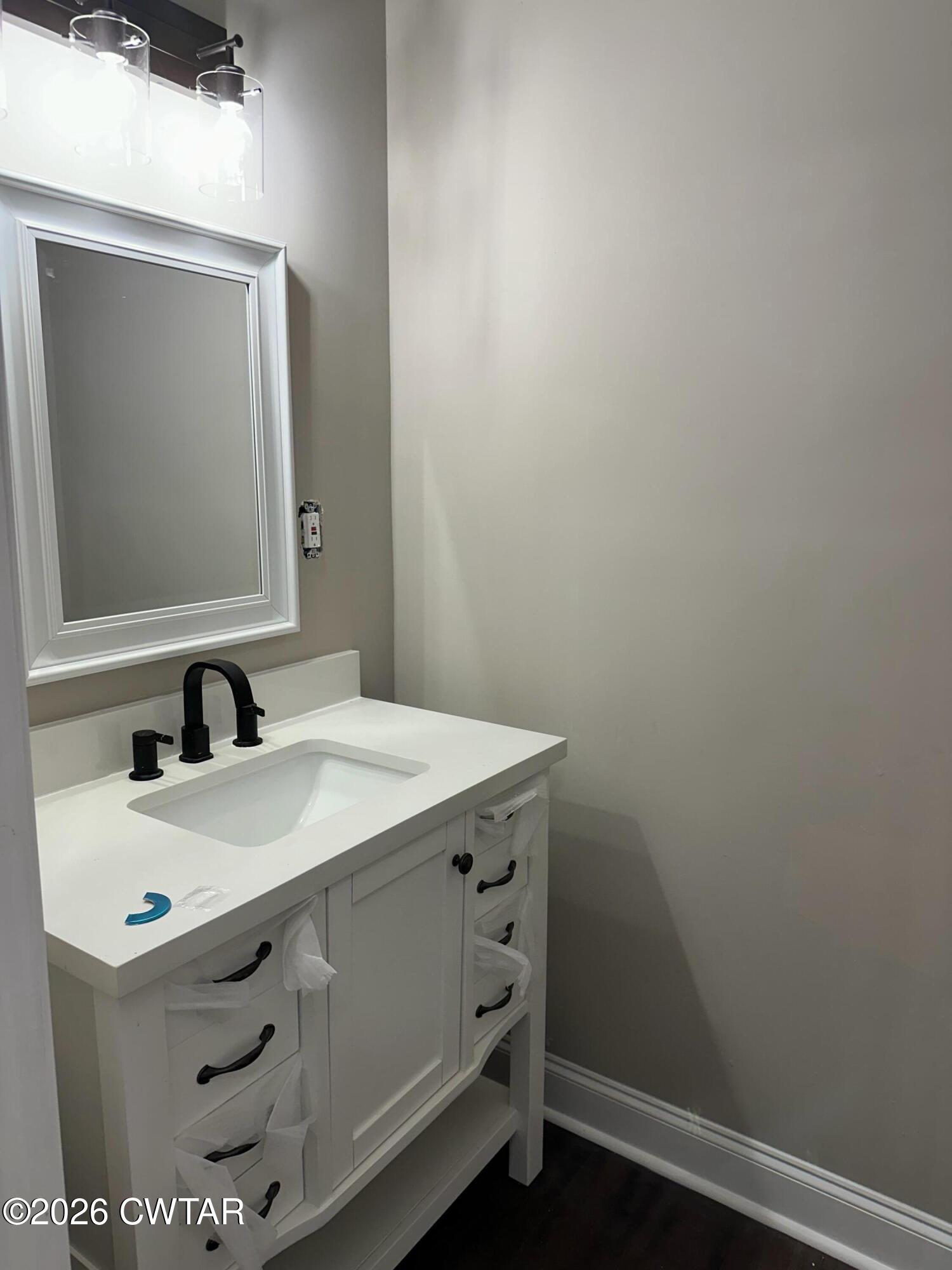 237 Talbot Street Jackson, TN 38301 - Photo 29 of 38 a bathroom with a sink and a mirror