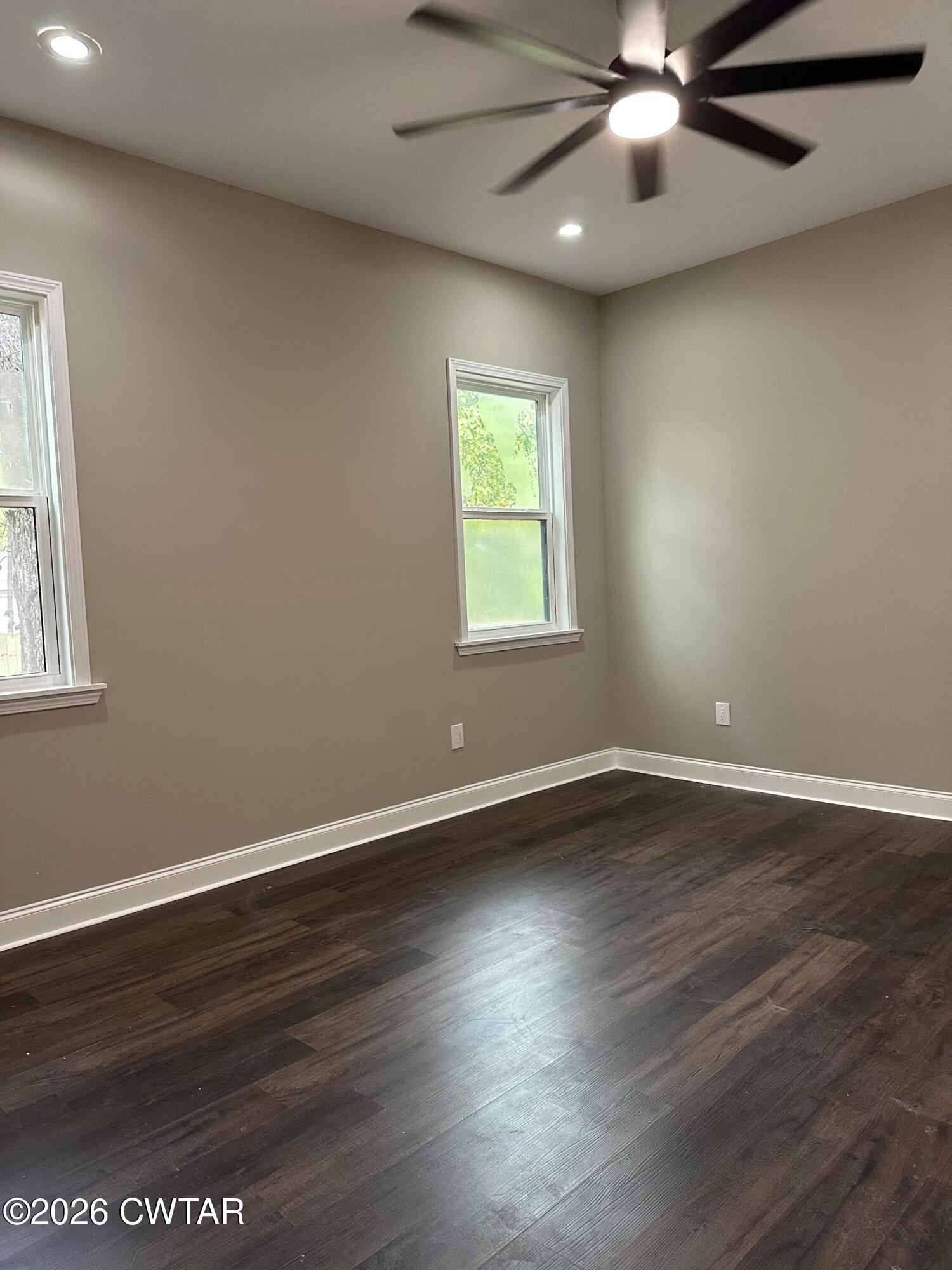 237 Talbot Street Jackson, TN 38301 - Photo 33 of 38 an empty room with wooden floor fan and windows