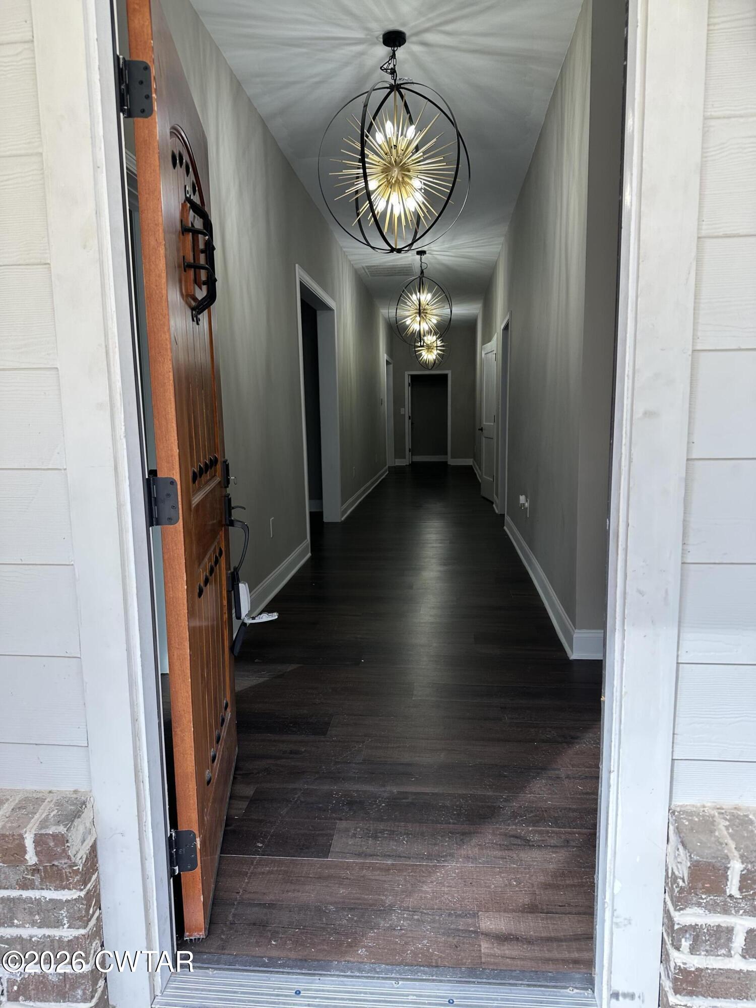 237 Talbot Street Jackson, TN 38301 - Photo 4 of 38 a view of a hallway with wooden floor and staircase
