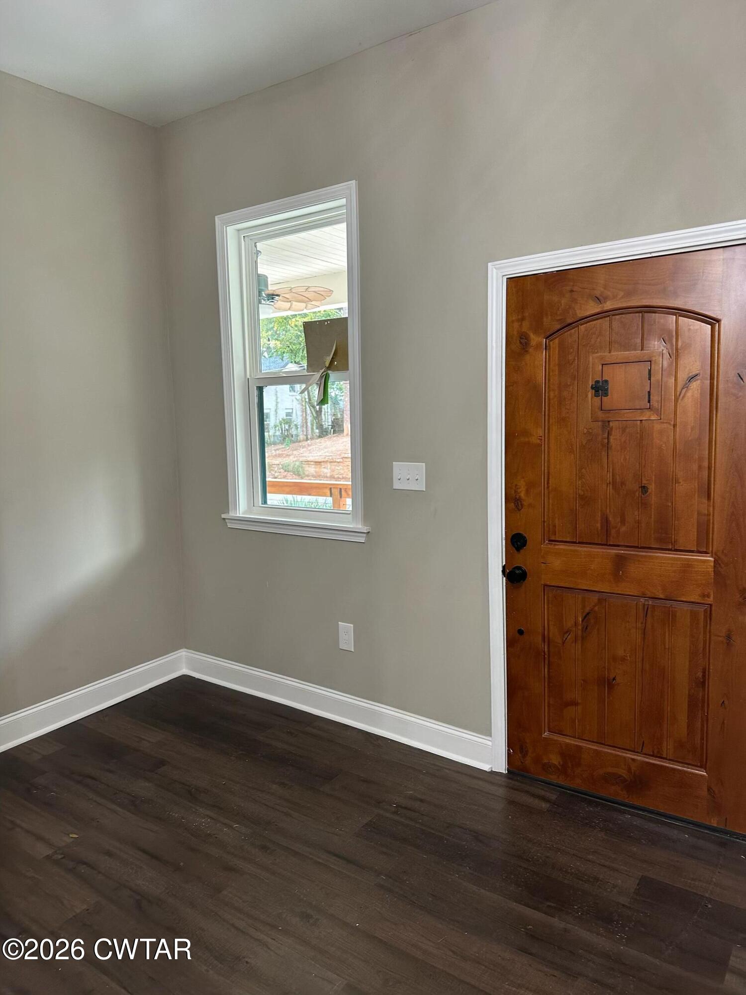 237 Talbot Street Jackson, TN 38301 - Photo 5 of 38 an empty room with wooden floor closet and windows