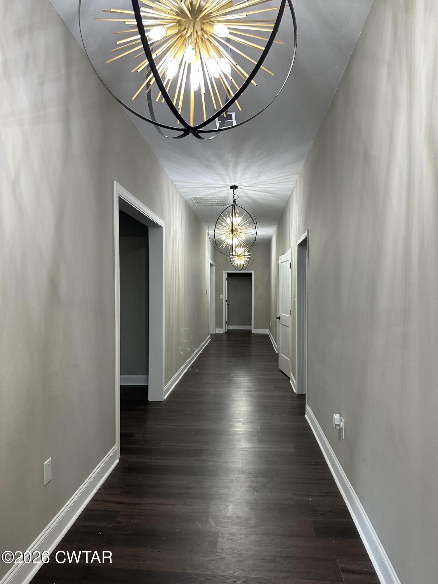 237 Talbot Street Jackson, TN 38301 - Photo 8 of 38 a view of a hallway with wooden floor