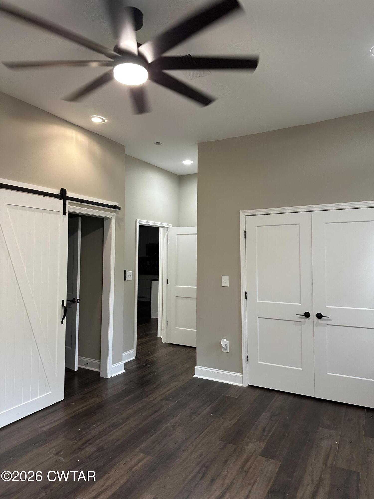 237 Talbot Street Jackson, TN 38301 - Photo 10 of 38 a view of an empty room with wooden floor
