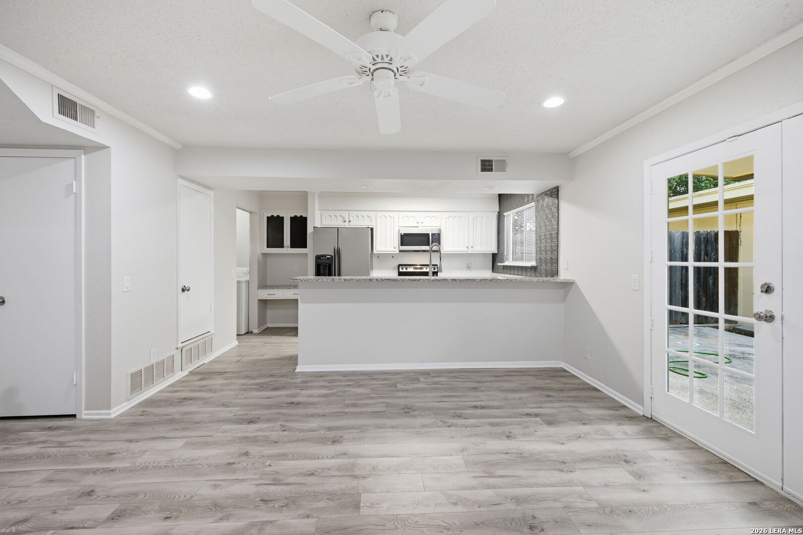 6106 Vance Jackson Road, Unit 15 San Antonio, TX 78230 - Photo 10 of 30 a living room with stainless steel appliances kitchen island granite countertop a refrigerator and a stove top oven