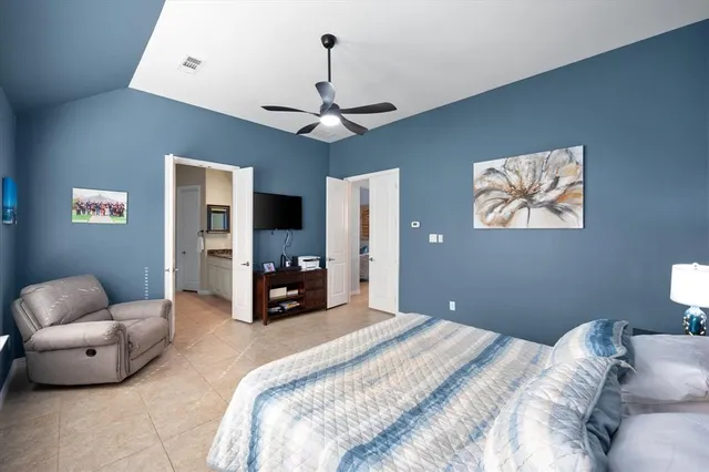 a bedroom with bed and furniture