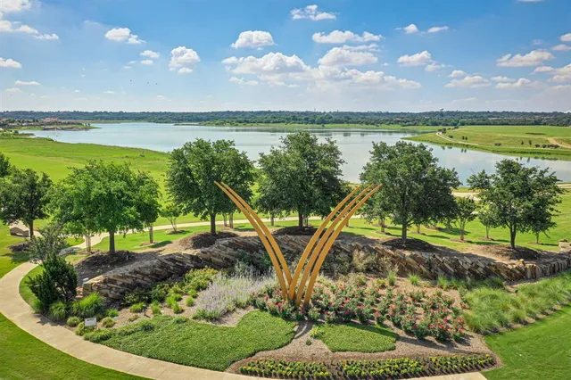 a view of a yard with an ocean view