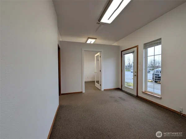 an empty room with windows