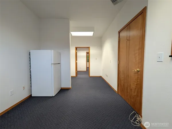 a view of a hallway with closet