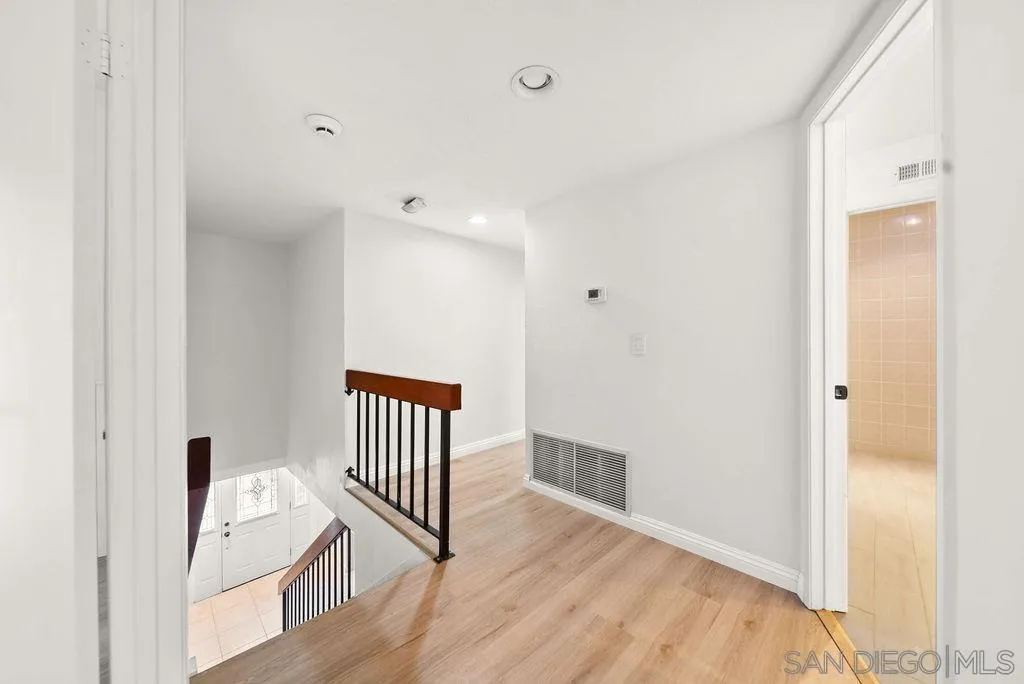 2210 Valley Road Oceanside, CA 92056 - Photo 14 of 45 a view of a hallway with wooden floor