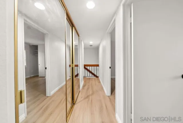 a view of a patio with table and chairs potted plants and palm tree