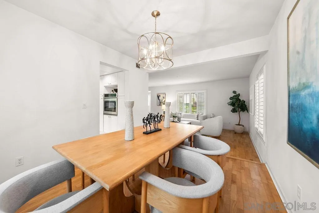 2210 Valley Road Oceanside, CA 92056 - Photo 5 of 45 a view of a dining room with furniture and wooden floor