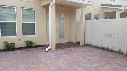 7652 Ripplepointe Way Windermere, FL 34786 - Photo 17 of 21 a view of a house with backyard