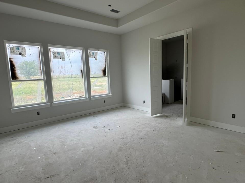 2305 Quartz Street Krum, TX 76249 - Photo 10 of 18 an empty room with windows and closet