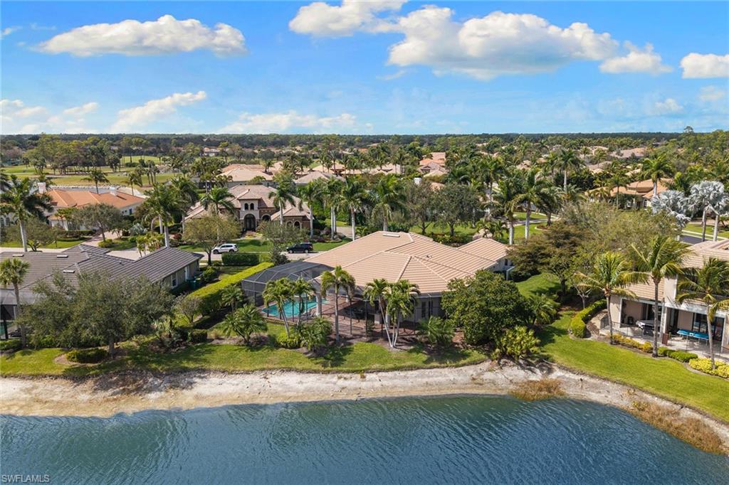 7506 Hogan Court Naples, FL 34113 - Photo 46 of 49 Aerial view of residential area featuring a large body of water