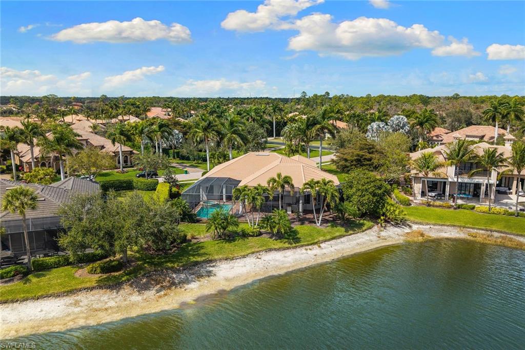 7506 Hogan Court Naples, FL 34113 - Photo 47 of 49 Drone / aerial view of a nearby body of water