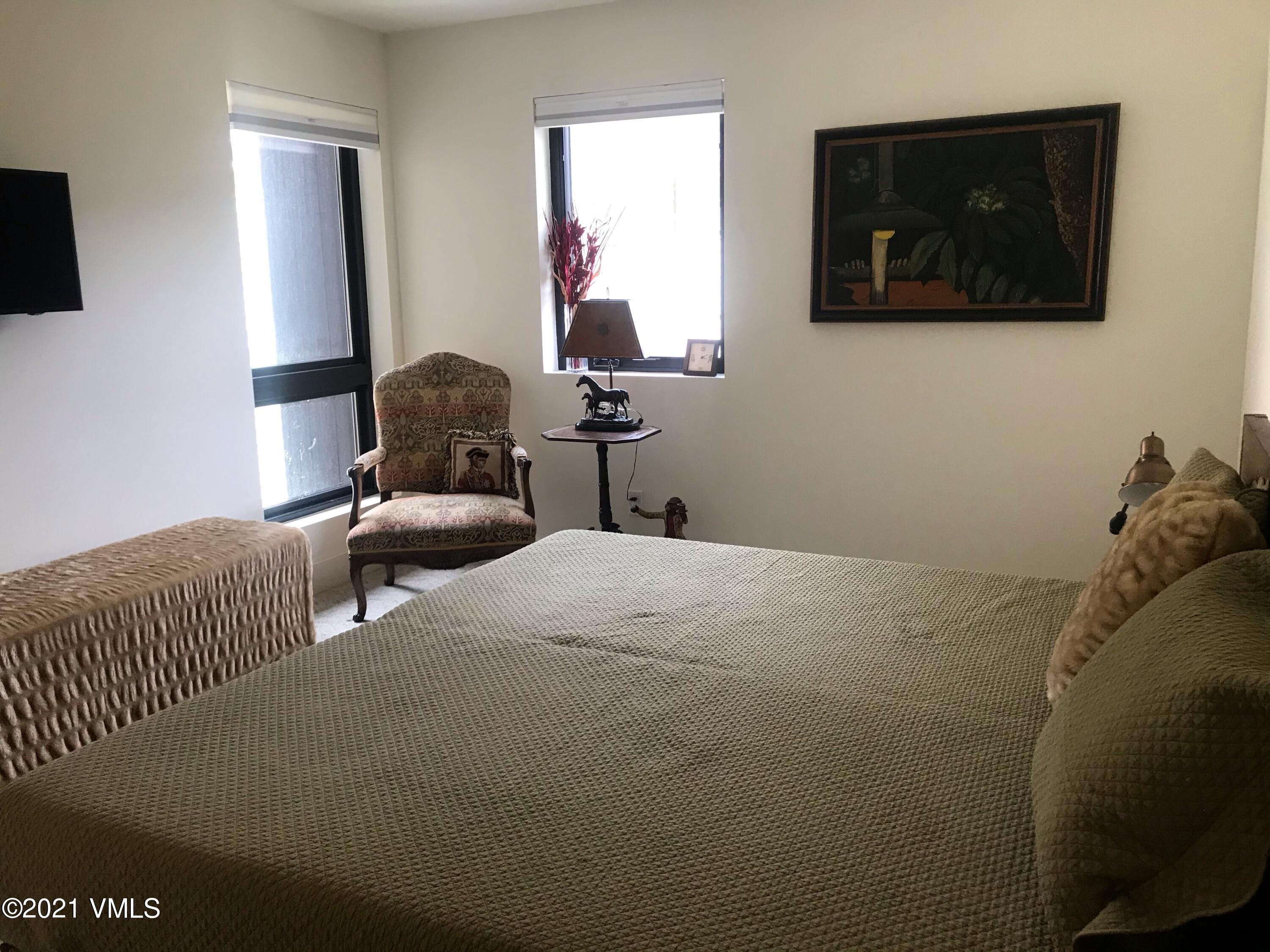 1133 Main Street Minturn, CO 81645 - Photo 12 of 13 a bedroom with a bed and a flat screen tv