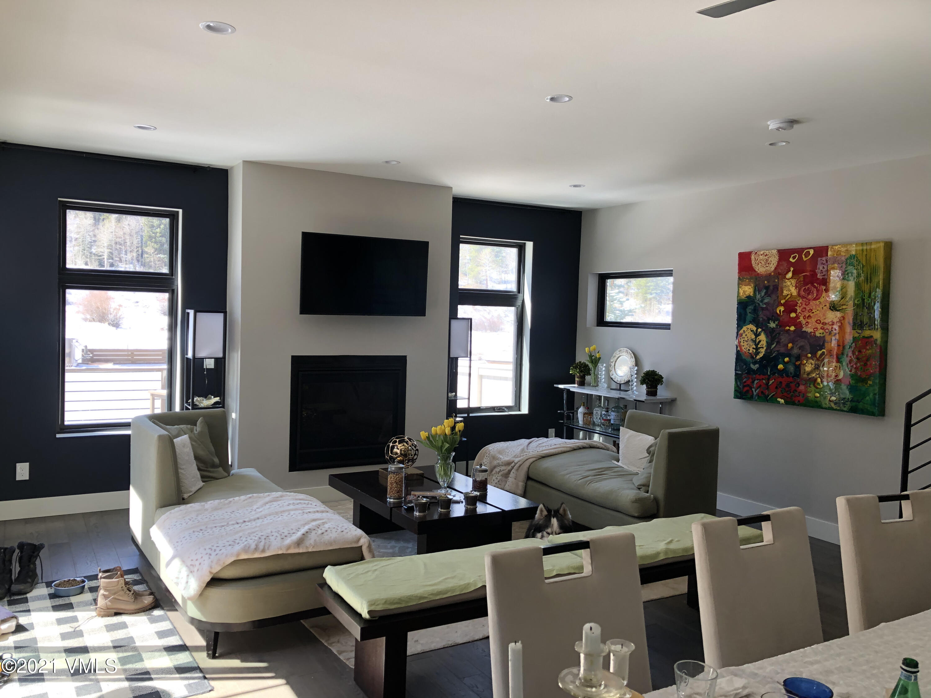 1133 Main Street Minturn, CO 81645 - Photo 10 of 13 a living room with furniture a flat screen tv and a fireplace