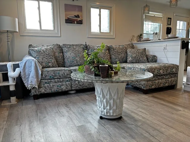 a living room with furniture and a large window