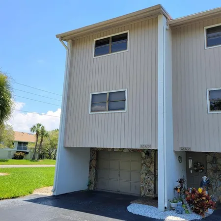 a house view with a backyard space