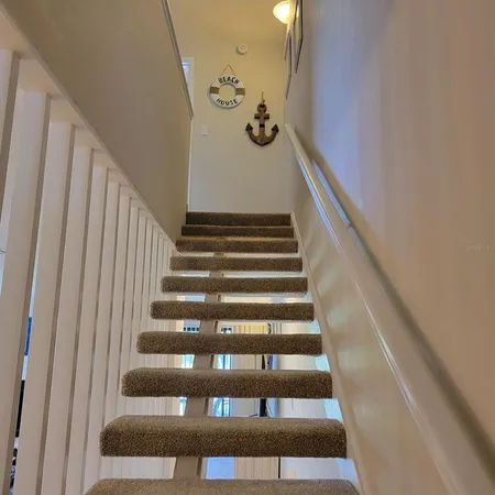 a view of a bathroom from a hallway
