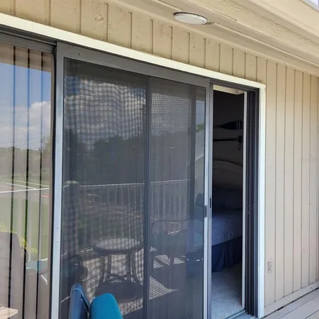 a front view of a house with a deck