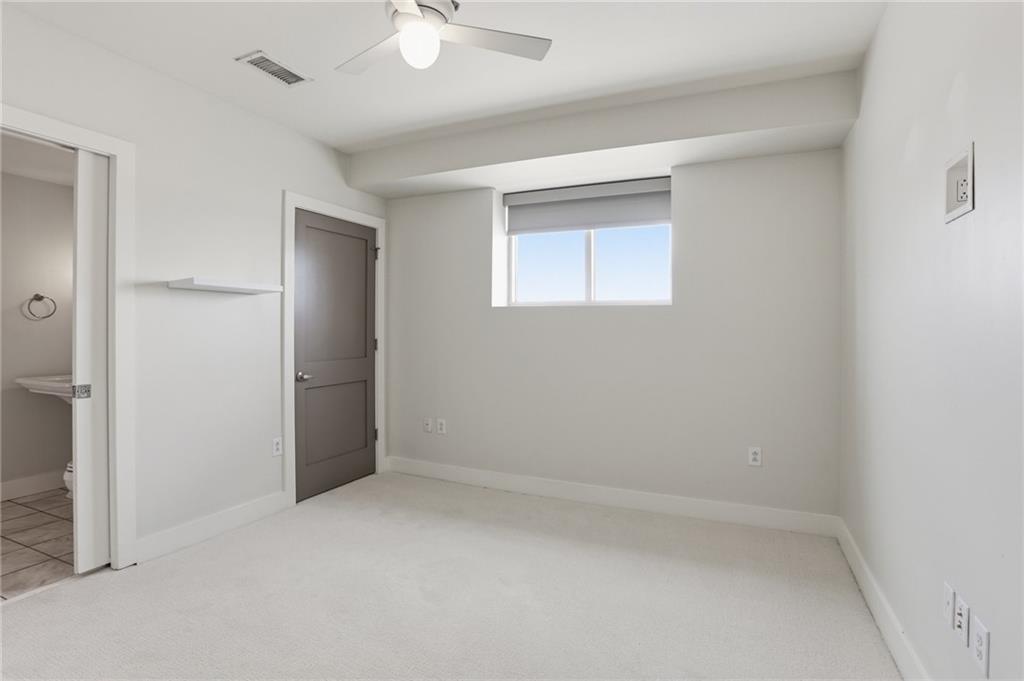 1100 Howell Mill Road Northwest, Unit 608 Atlanta, GA 30318 - Photo 21 of 37 an empty room with a empty space
