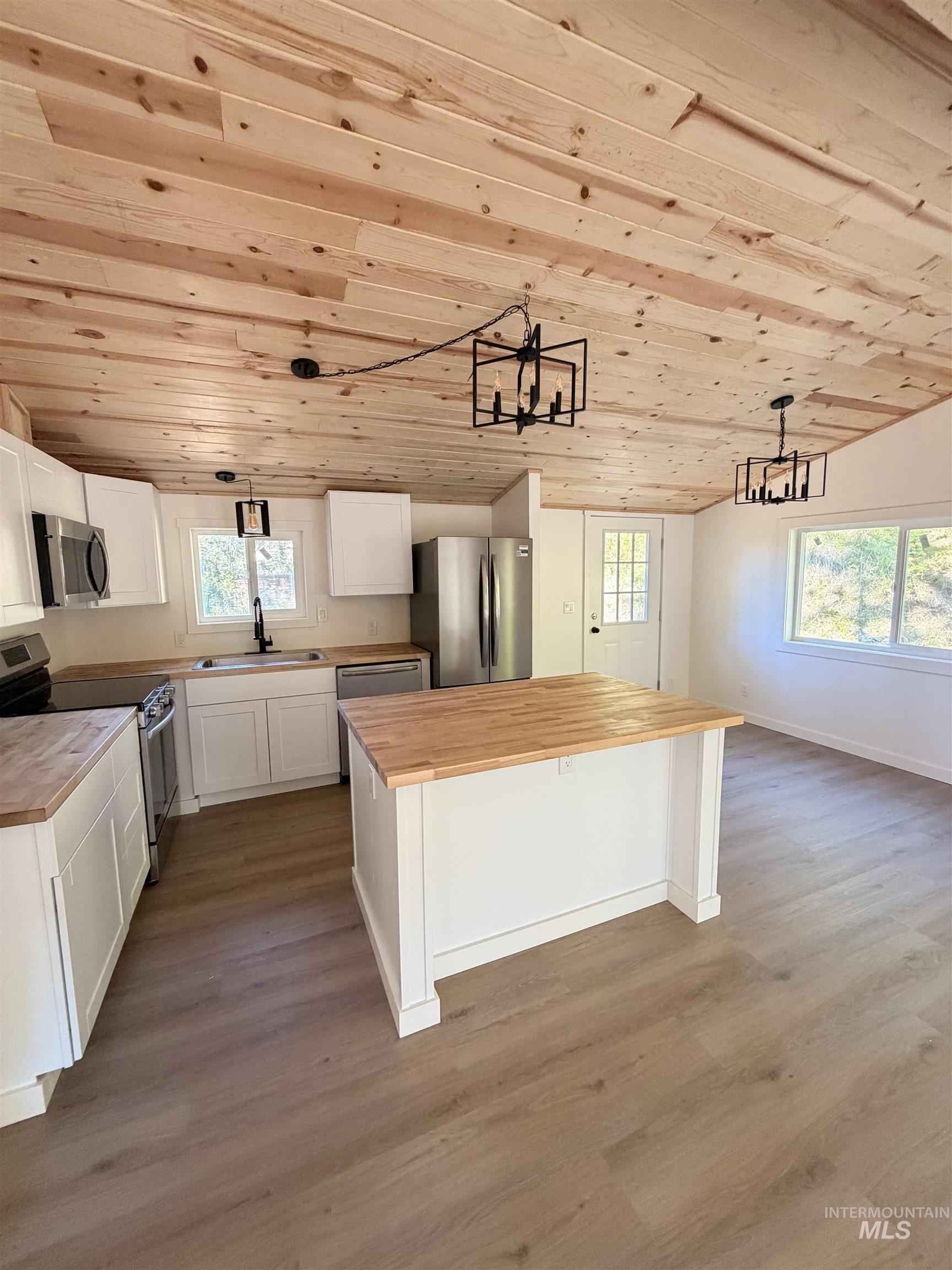 151 View Road Kamiah, ID 83536 - Photo 11 of 49 Kitchen featuring stainless steel appliances, white cabinetry, and wood-finish countertops