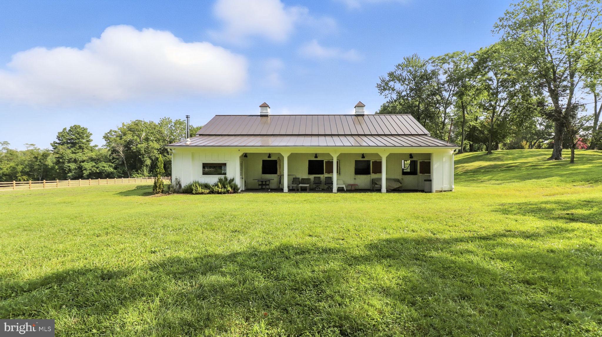 11305 Riverview Road Fort Washington, MD 20744 - Photo 2 of 59 a front view of a house with a garden