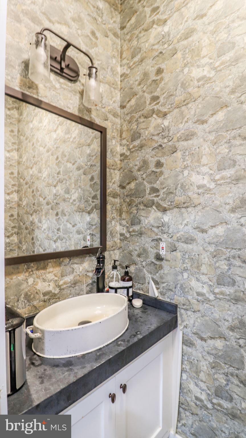 11305 Riverview Road Fort Washington, MD 20744 - Photo 43 of 59 a bathroom with a sink and a mirror