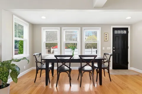 a view of a dining room with furniture window and outside view