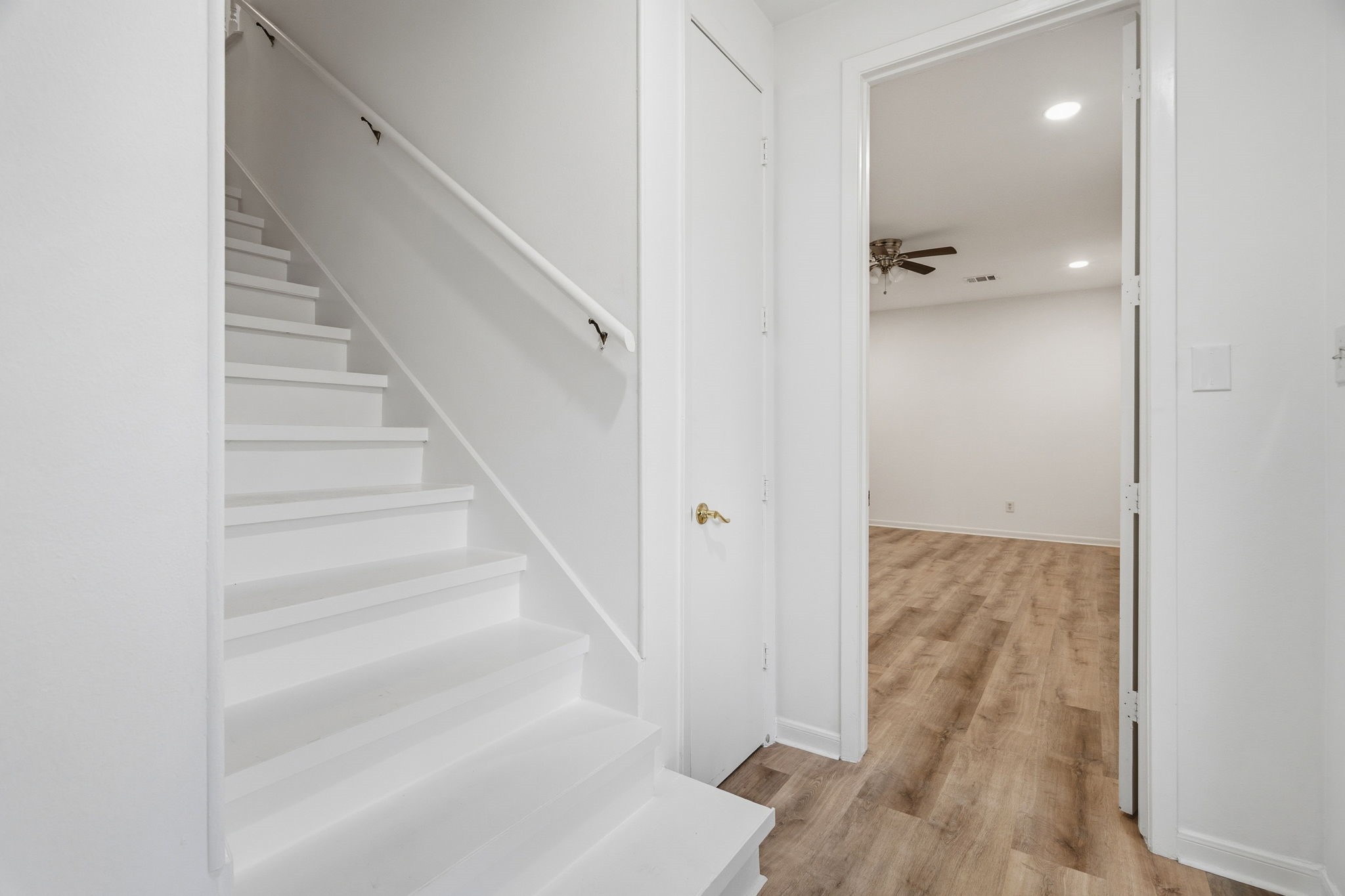 1616 Kipling Street, Unit C Houston, TX 77006 - Photo 16 of 34 a view of a hallway with wooden floor and staircase